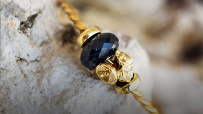 Bracelet Trollbeads plaqué or avec une perle d'onyx noir facettée